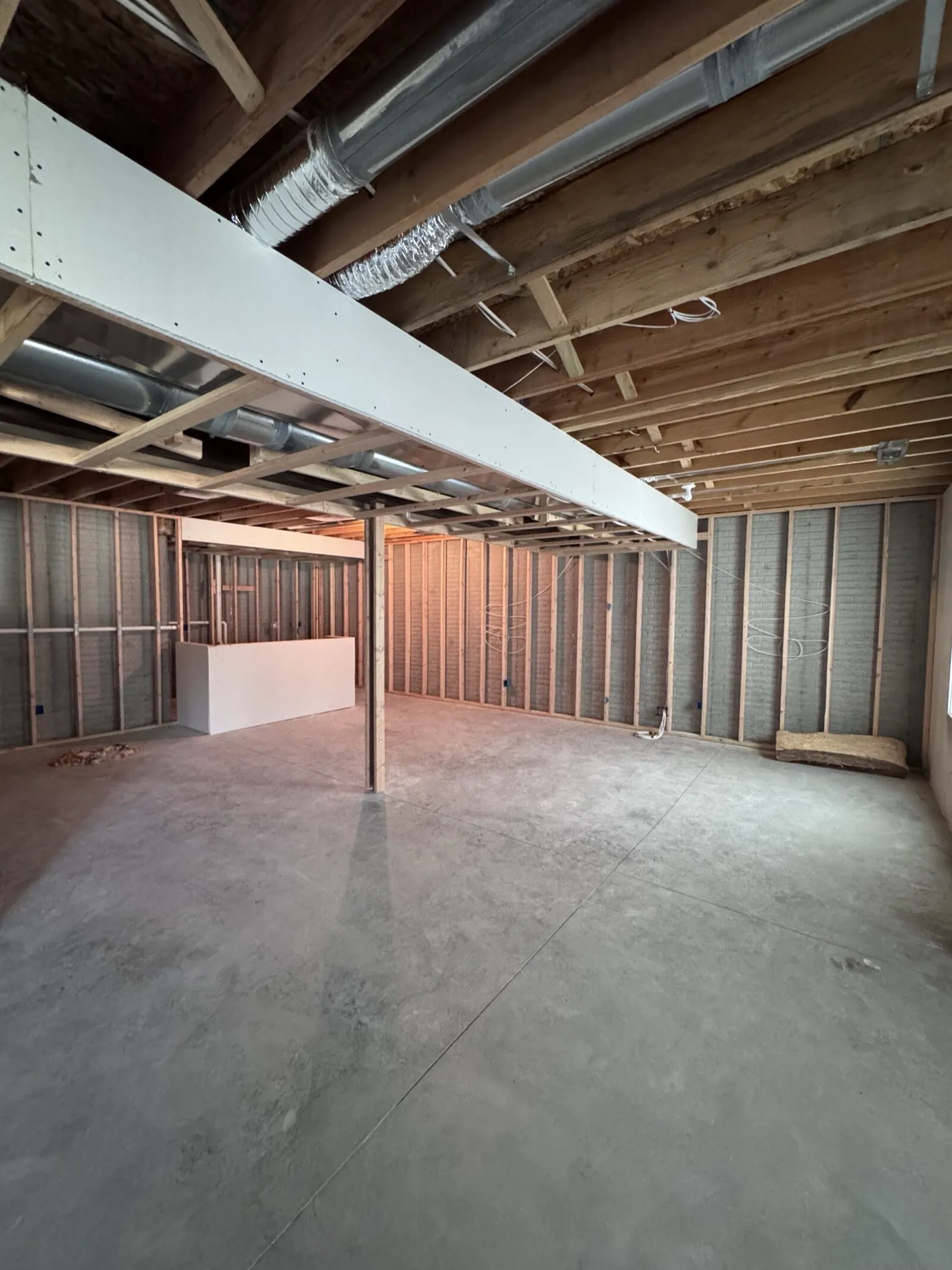 Basement after finishing - completed living space with bar and entertainment area