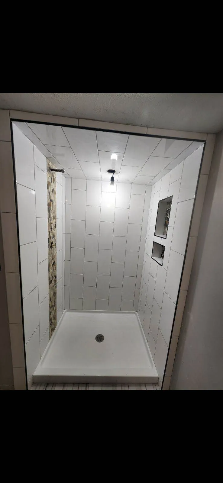 Contemporary bathroom design with frameless glass shower enclosure