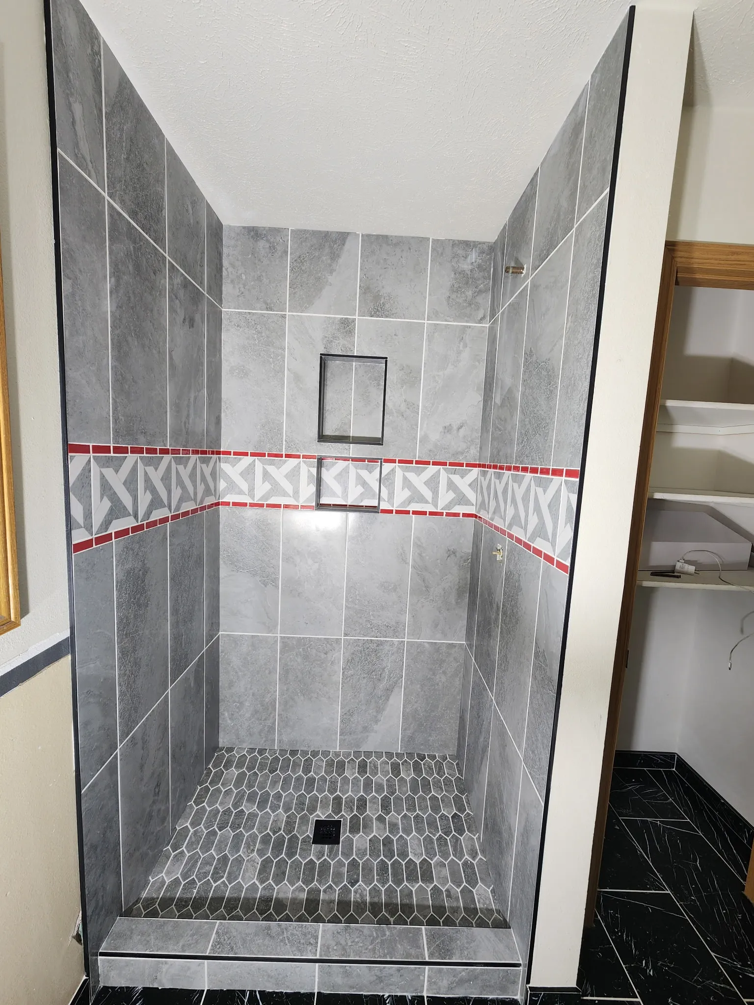 Full bathroom renovation featuring modern fixtures and accent lighting