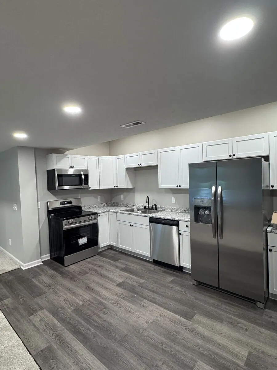 Modern kitchen remodel with quartz countertops and updated fixtures in Omaha home